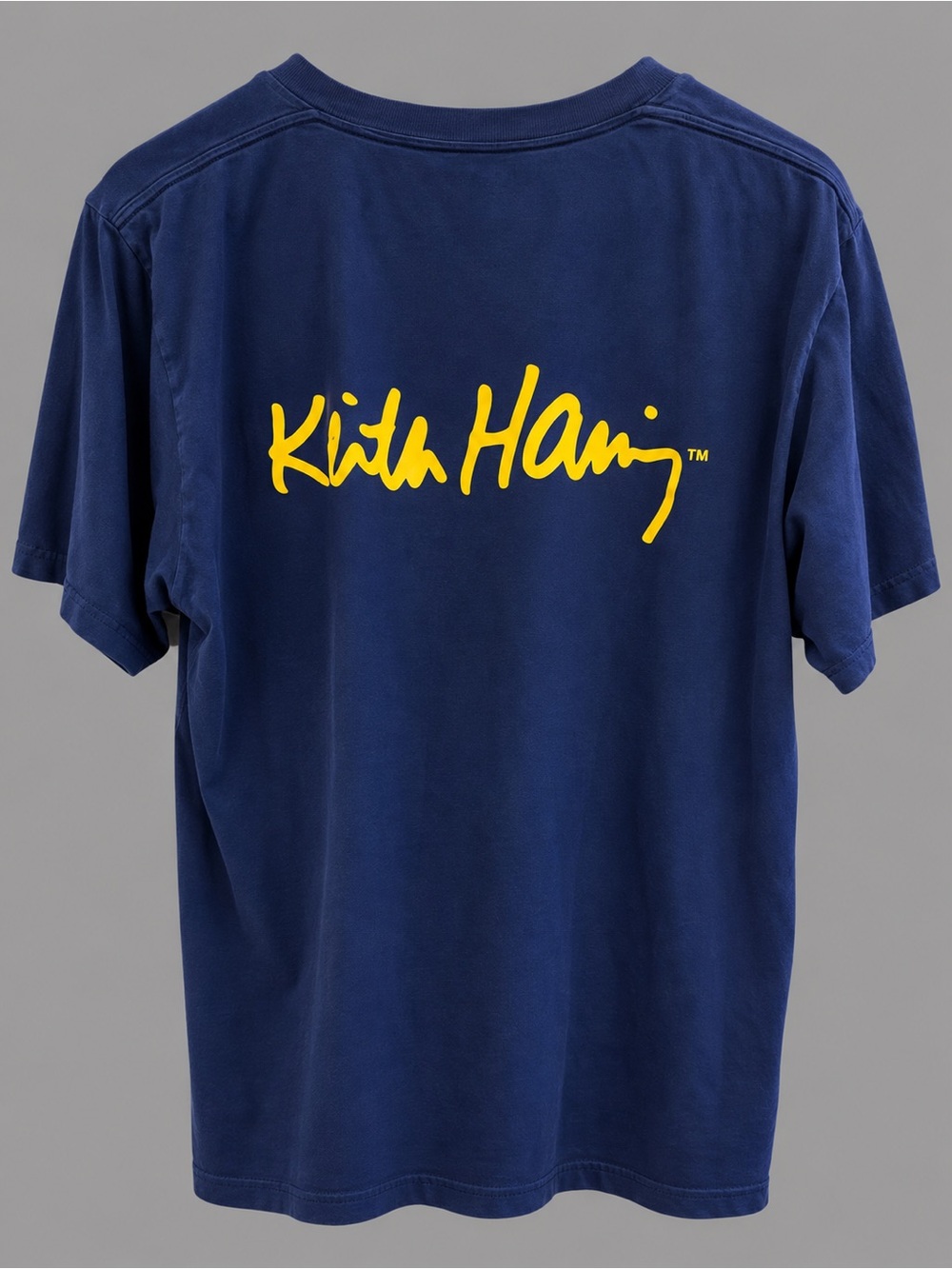 UNIQLO UT Keith Haring Navy Short Sleeve Tee w Yellow Script Logo